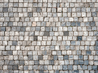 Cobbles. Abstract background texture of marble cobble stones in the Old Town district of Prague, Czech Republic.