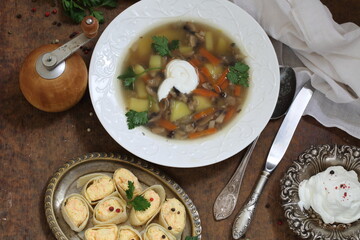 mushroom soup puree with crackers on a wooden table