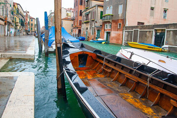 Boats and ancient houses in the channels of Venice, Venetian, Italy