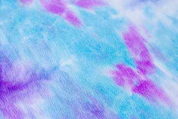 Blue, turquoise and pink corduroy background for decoration and postcards. Purple and violet colors. Bright horizontal background from corduroy fabric
