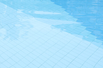 Top view of the pool water, tiles and clear water