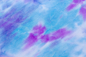 Blue, turquoise and pink corduroy background for decoration and postcards. Purple and violet colors. Bright horizontal background from corduroy fabric