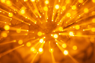 Abstract bokeh background explosion of golden lights