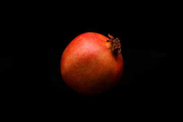 Pomegranate fruit on black background