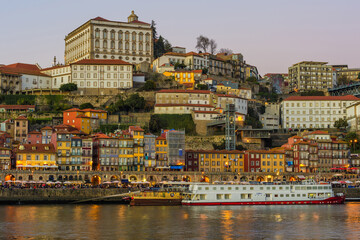 Fototapeta na wymiar Sunset over Ribeira district and former Episcopal Palace, Unesco World Heritage Site, Porto, Portugal