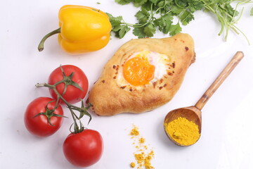 Adjarian khachapuri, pie with cheese on a white plate