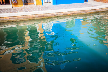 Reflecion in the channels of Burano, colourful island in the bay of Venice, Italy