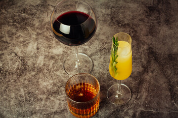red wine, citrus and whiskey cocktail and text space.