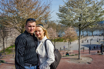  A couple of young people have fun on the streets of city.