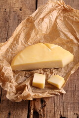 Cheese Gruyere on a wooden background