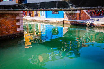 Reflecion in the channels of Burano, colourful island in the bay of Venice, Italy