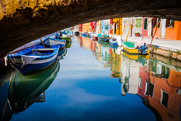 Naklejka na ściany i meble Reflecion in the channels of Burano, colourful island in the bay of Venice, Italy