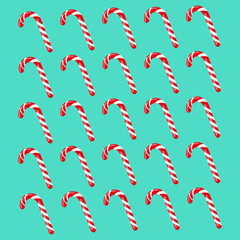 Red and white striped Candy Canes on a peppermint background vector illustration