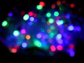 Obraz premium Colored lights spots on a black background