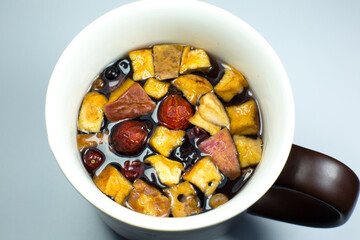 Herbal tea with dry fruits. Healthy drink in cold weather.