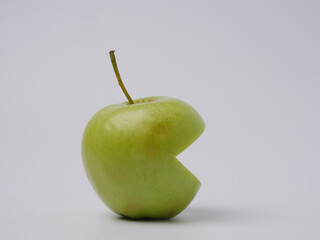 A green Apple fruit with a green Apple half isolated on a white background. Green apples with a cropped path. Full depth of field