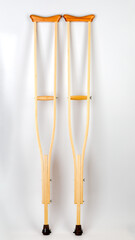 Wooden crutch on a white isolated background. Medical equipment