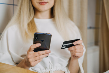 Shopping online, Savvy Shoppers, Installment Payments. Woman at home using credit card and laptop for online payment. Internet shopping concept