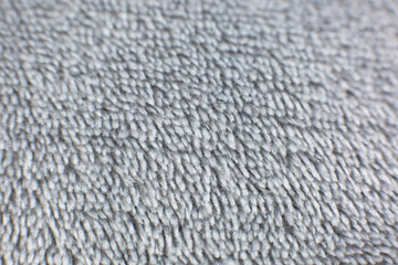 Grey cotton towel or carpet.fluffy texture background. Close up photo.