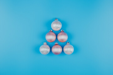 Christmas or New Years minimalistic background, with Christmas balls on blue.