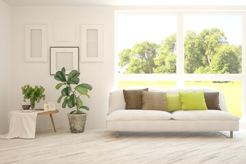 White living room with sofa and summer landscape in window. Scandinavian interior design. 3D illustration
