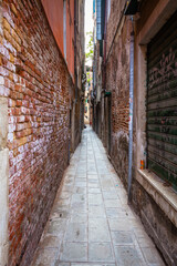 Fototapeta na wymiar Small street in Venice, Venetian, Italy