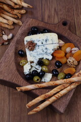 Blue cheese with nuts and olives