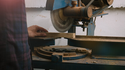Carpenter working with equipment on wooden table in carpentry shop. woman works in a carpentry shop.