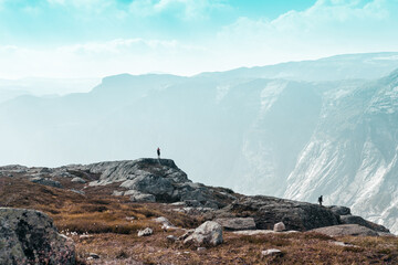 two people against the backdrop of the majestic Norwegian mountains