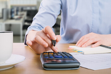 Close up accountant auditing accounting reports, profit and loss data, analytical graph marketing