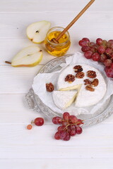 Camembert with honey, pear and grapes