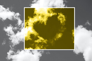 Beautiful panoramic landscape with gray sky and clouds in the shape of a heart. Colors yellow and gray , Color of the year of 2021 Illuminating , Ultimate Gray. Love and Valentine's Day concept.