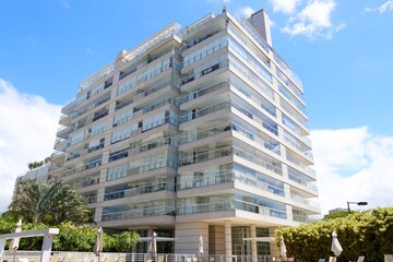 External view of a modern building. Blue sky and sunny bright day 
