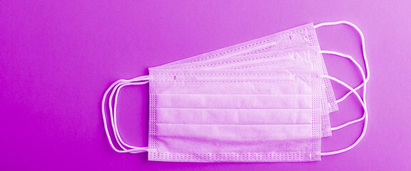 Medical mask protective virus, flu, disease. Isolated on a lilac background.