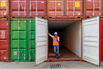 worker in warehouse with container