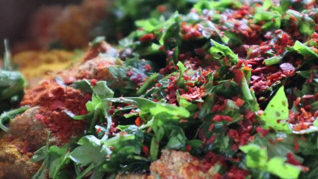 Close up shot of perparation of turkish dolma meal.Rice,red pepper,parsley and sumac.