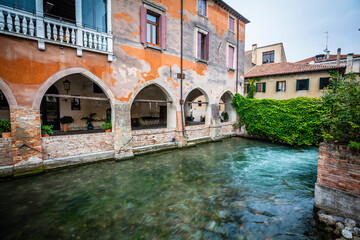 Fototapeta na wymiar Refelections in the channels of Treviso, Venetian, Italy