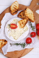 Camembert with grilled baguette and tomatoes