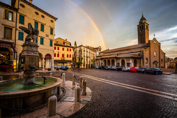 Dark clouds and a rainbow over the village of Asolo in Venetian, Italy