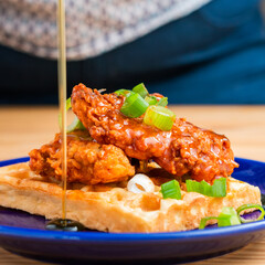 Homemade Southern American comfort street food fresh deep fried crispy stacked chicken wings with...