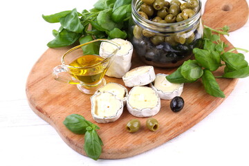 Still life сheese saint-mor-de-Touren on wooden background