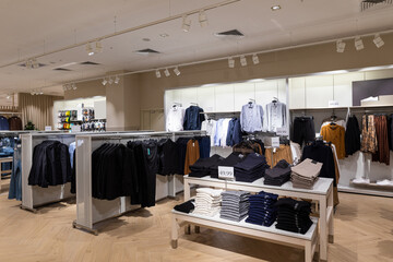 Modern fashionable brand interior of clothing store inside shopping center
