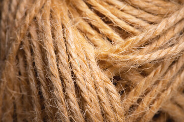 Natural rope twine textured background close up plan. Fibers in a mess rustic style