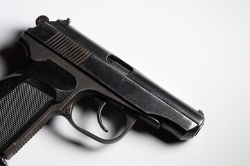 Old Soviet pistol. Close-up on white background