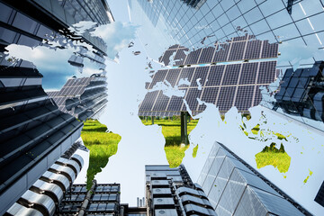 Concept piece showing Skyscrapers with global map and a scene of renewable energy, solar panels and wind farms. Depicts corporate business effort and responsibility to reduce carbon emissions globally