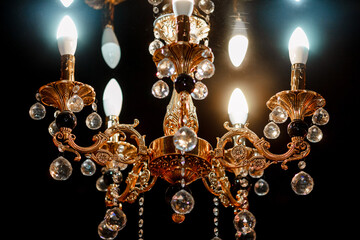 Contemporary glass chandelier isolated over black background. Chandelier for interior of the living...
