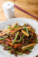 Chinese-style stir-fry containing green peppers and meat