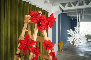 Poinsettia of Christmas decoration on wooden ladder