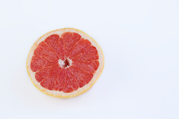 Half grapefruit against white background with copy space