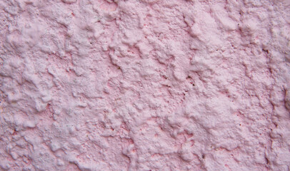 Old style vintage abstract pink grunge cement wall texture background.